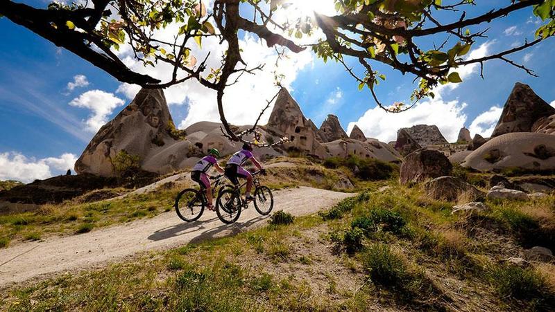 Mountain Bikers riding in Cappadocia, which is a well-known destination for its natural MTB trails