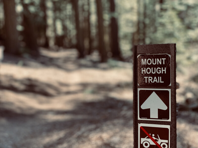 Beginning of the second half. You'll miss this sign on the climb, but it's easy to find on your right during the descent.