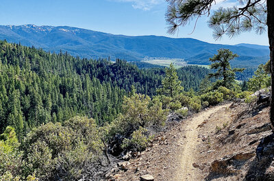 Vista of the valley on the way down, getting closer to the bottom. Note the skinny singletrack!