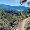 Vista of the valley on the way down, getting closer to the bottom. Note the skinny singletrack!