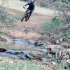 Crossing the creek at the bottom - almost done with the downhill.