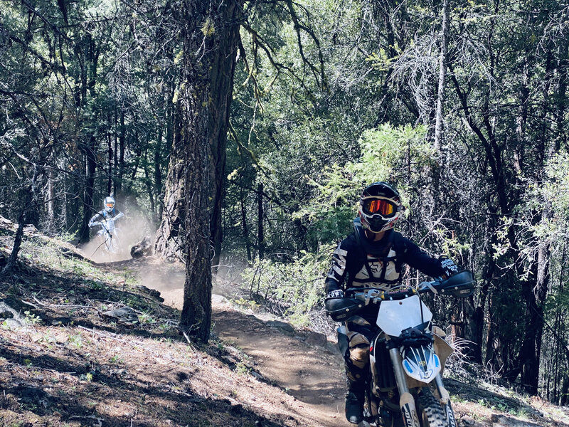 Yep, motos are here too! It's about to get steep and technical on this climb.