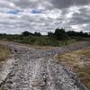 A recently tilled fire break road makes for difficult riding conditions.