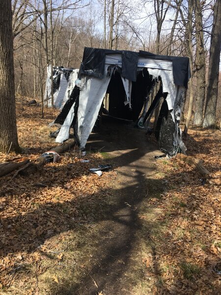 Lumber tarp tunnel.