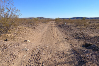 Looking back towards the Batamote Mountains from the end of the northern terminus of 8106 at the boundary with the Barry M. Goldwater Range to the north (DoD).