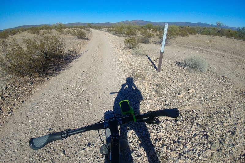 Looking N down the Desert Luge (BLM 8110A), with Batamote Mountain on the horizon.