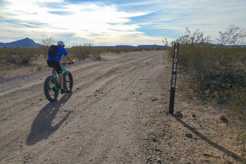 Looking E from just W of the intersection of Pipeline Road (BLM 8100) and BLM 8108 (unmapped as of May 2021). Fattire Mike suffering as one should...