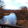 Peaceful resting spot on the wooden bridge across Boulder Creek.