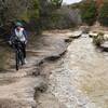 Riding along the spillway.