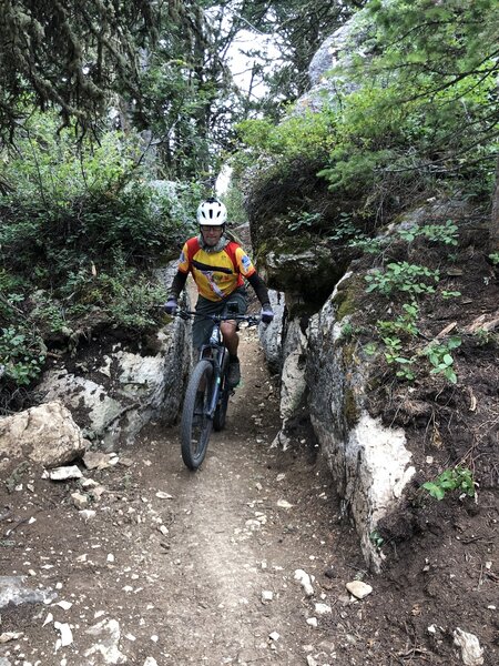 This narrow rock passage is one of the many features this trail has to offer!