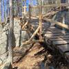 Large cedar bridge descending off a bluff.