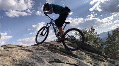 Brandon on the Slab Boulder Problem… with his bike!