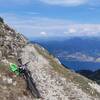 The old military trail to Bocchetta del Coal Santo: view down to Lago di Garda and the Adamello-Mountains in the back