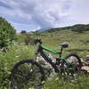 Beside Sentiero #5: View to Monte Baldo (Cima Costabella) and to the buildings of Malga Montesel