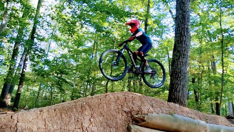 My son clearing the steep faced jump after the drops.