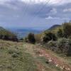 View from the meadows of Valdabin to Lago di Garda, here the Ziloncello Singletrack changes to Fintanorbole Doubletrack