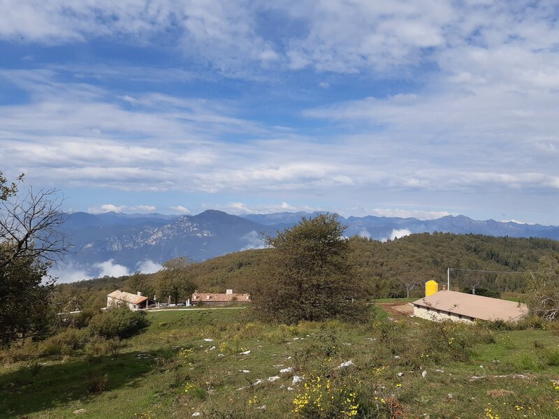 The view down to Malga Baito dei Santi, elev.970m (under the clouds is Lago di Garda)