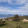 The view down to Malga Baito dei Santi, elev.970m (under the clouds is Lago di Garda)