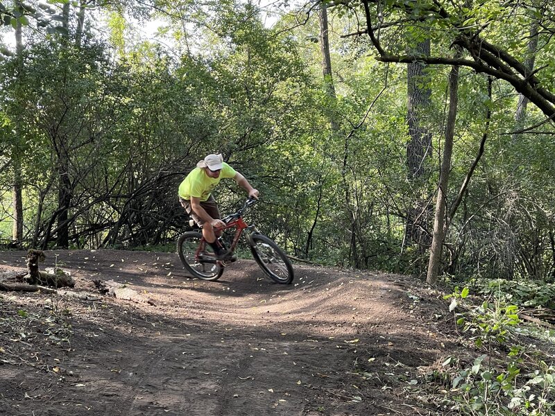 Flow checking a berm on the Brickyard trail.