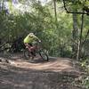 Flow checking a berm on the Brickyard trail.