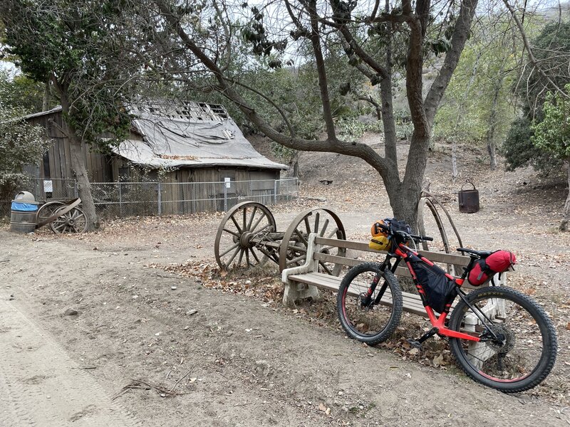 Old barn off of Middle Ranch Road with some ancient wagon wheels and plows.