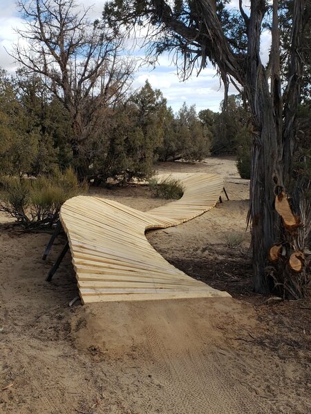 Wooden Burm to Burm over sandy area.