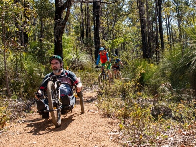 Hand cycle being ridden on Aklow trails.