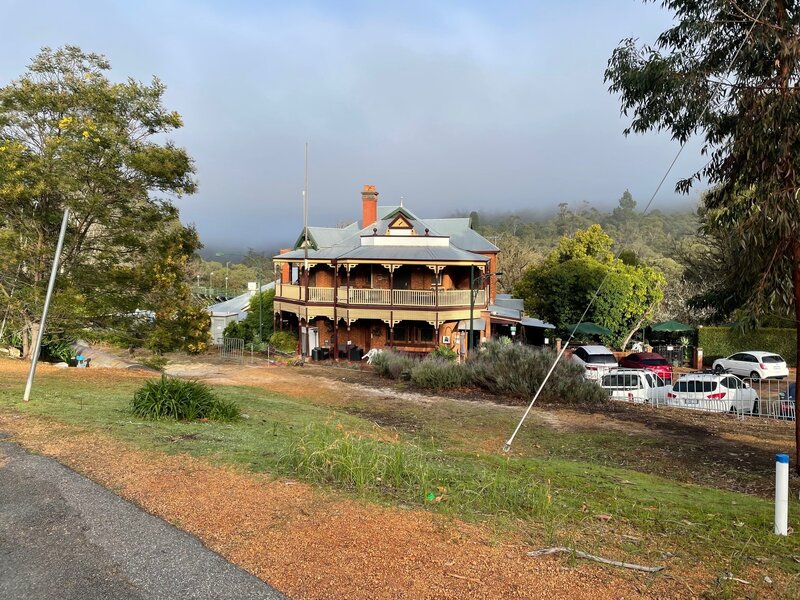 Mist hanging over the Mundaring Hotel on the Munda Biddi Trail. Photo credit: John de Bes