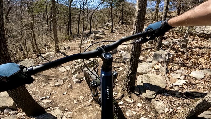 Enjoying the technical rock features on the River Bluff Trail at Cliff Cave Park. This photo was clipped from video footage taken on 03.20.2022.