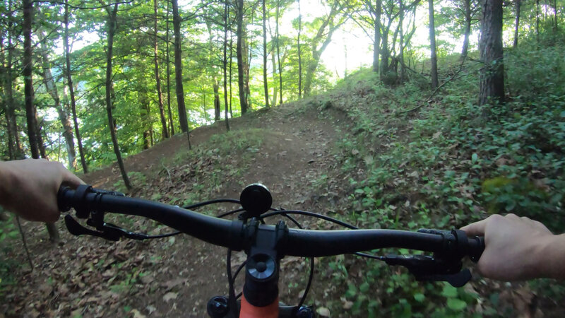 Begin descent to marina parking lot at this left-handed switchback.