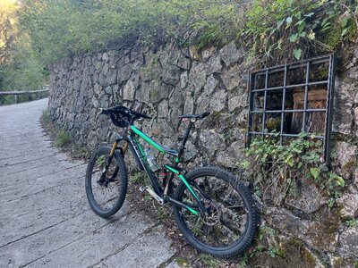 A small shrine with a crucifix beside Strada del Misone.