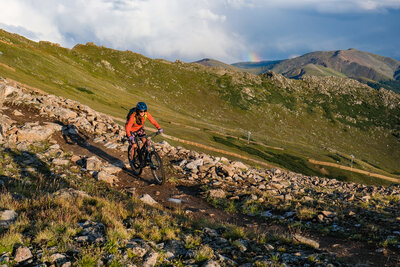 Riding along Zuma Cornice with views into the Montezuma Bowl winter ski terrain. Photo from July 2022.