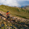 Riding along Zuma Cornice with views into the Montezuma Bowl winter ski terrain. Photo from July 2022.