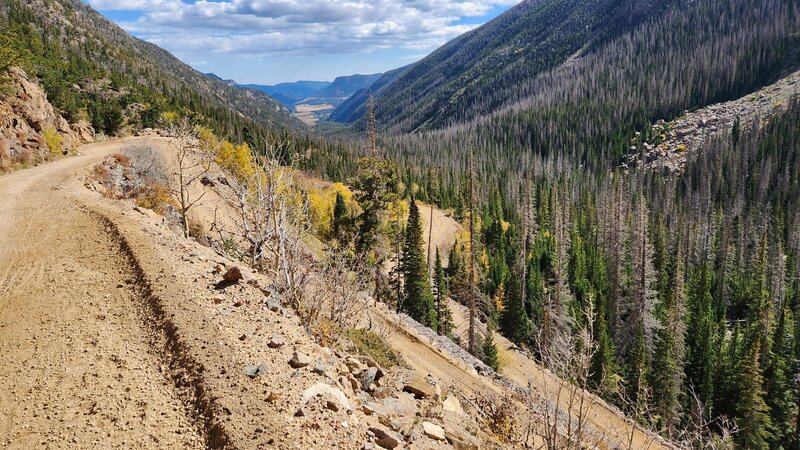 Coming down some switchbacks on Old Fall RIver Road with some fall colors and Endovalley in the distance.