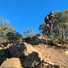 Hitting the larger of two drops that lead into the slickrock section of Poison Canyon.