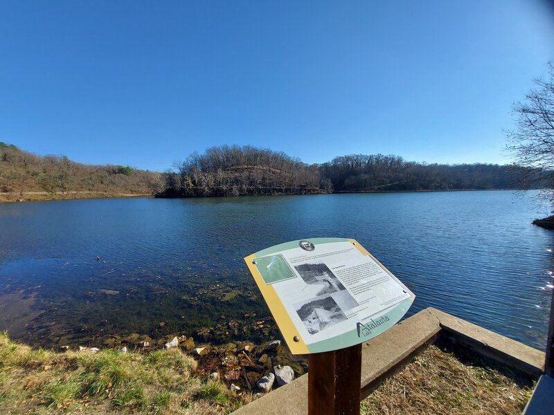 View over the lake with "The Grove" trail in the back