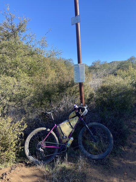 Sign at 6.9 mile marker: 'Avoid Arrest - Private Property'