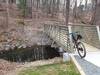 New bridge (photo is April '22) at Rt. 29 looking north. The current trail description mentions deep rocky gully that was here, but it's gone now. I typically ride up the left side trail shown, but the two reconnect over the hill.