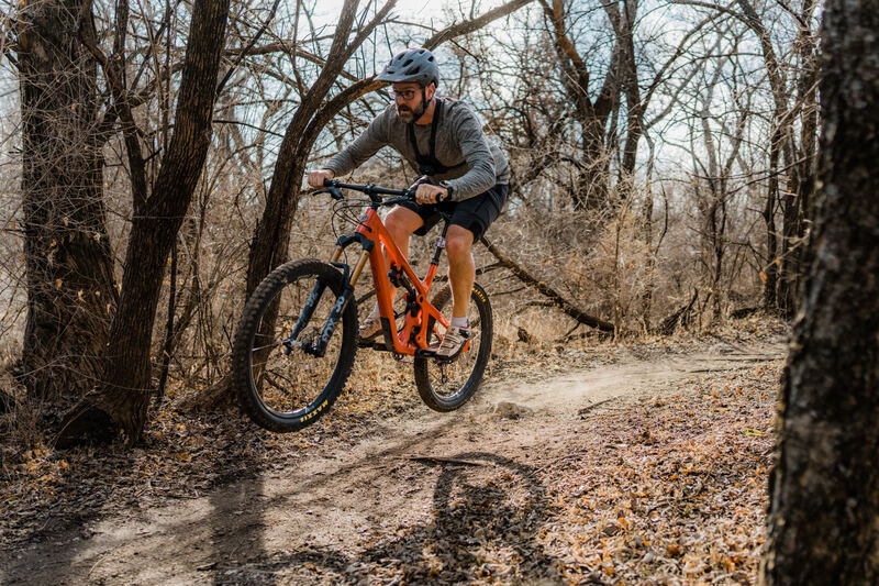 Mountain biker on the Santa Fe North Trail jumping his bike.