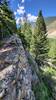 The stone wall from the old mining trail contributes to the exposure along most of the trail.