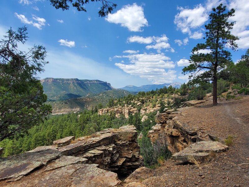 Trail runs along the top of pretty cliffs and rock formations.