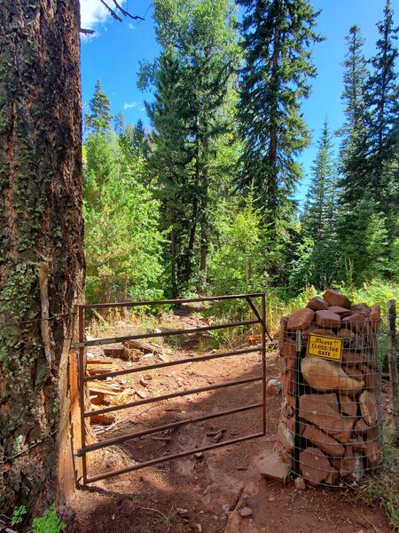 Gate near the bottom of Red Creek Trail.