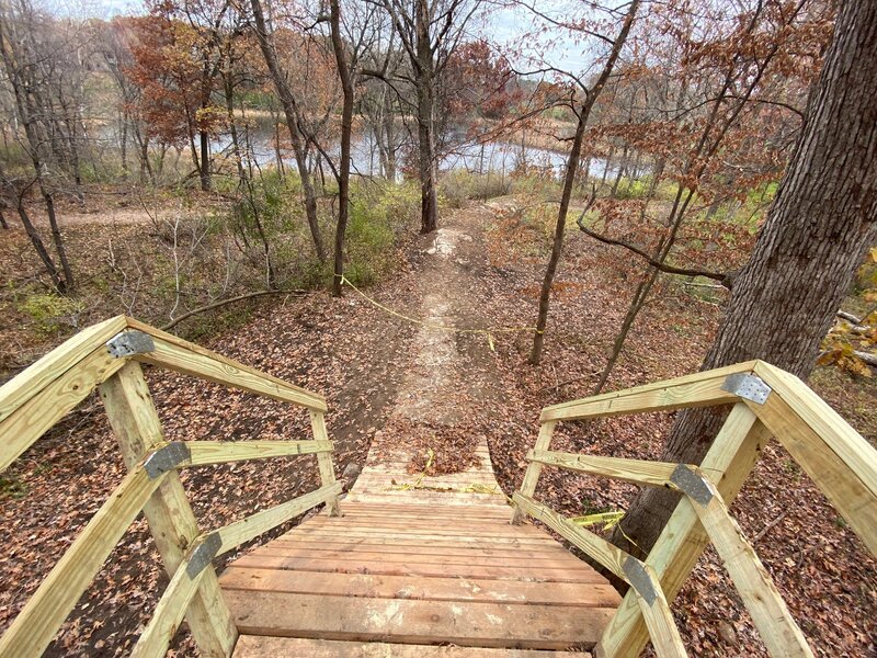 Roll-in bridge feature over hiking trail.
