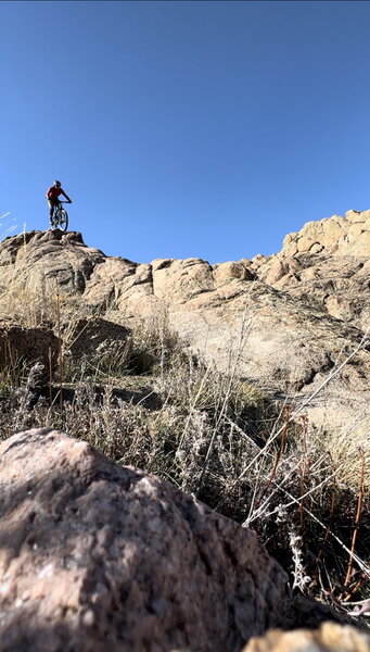 Riding the crux spine toward the end of Free Fall.