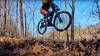 Jumping a berm onto an intersecting trail.