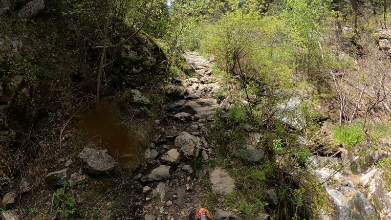 The photo completely robs just how steep and sketchy this really is. You'll for sure have to hike your bike up this.