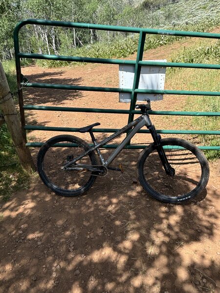Photo of the trail being done on a Dirt-Jump bike (one of the gates you have to cross, this 3/4 of the way down the shuttle route)