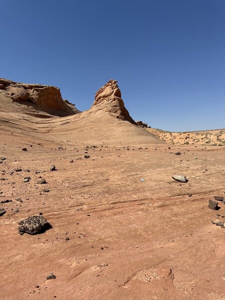 Sandstone spire with alt line, main trail goes right.