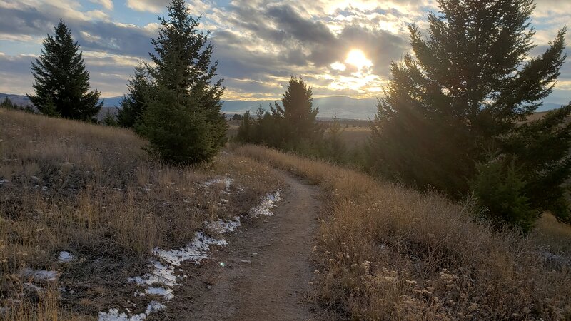 Sun peeking through the clouds, late in the fall on Whisky Gulch Trail