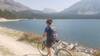 A mountain bike rider takes in the beautiful scenery on the Storm Lake Trail.